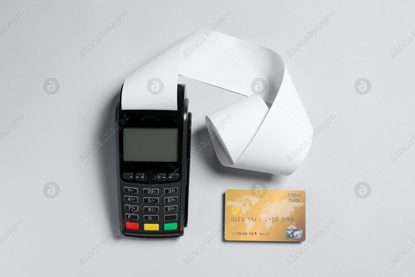 Photo of Payment terminal with thermal paper for receipt and credit card on light grey background, flat lay