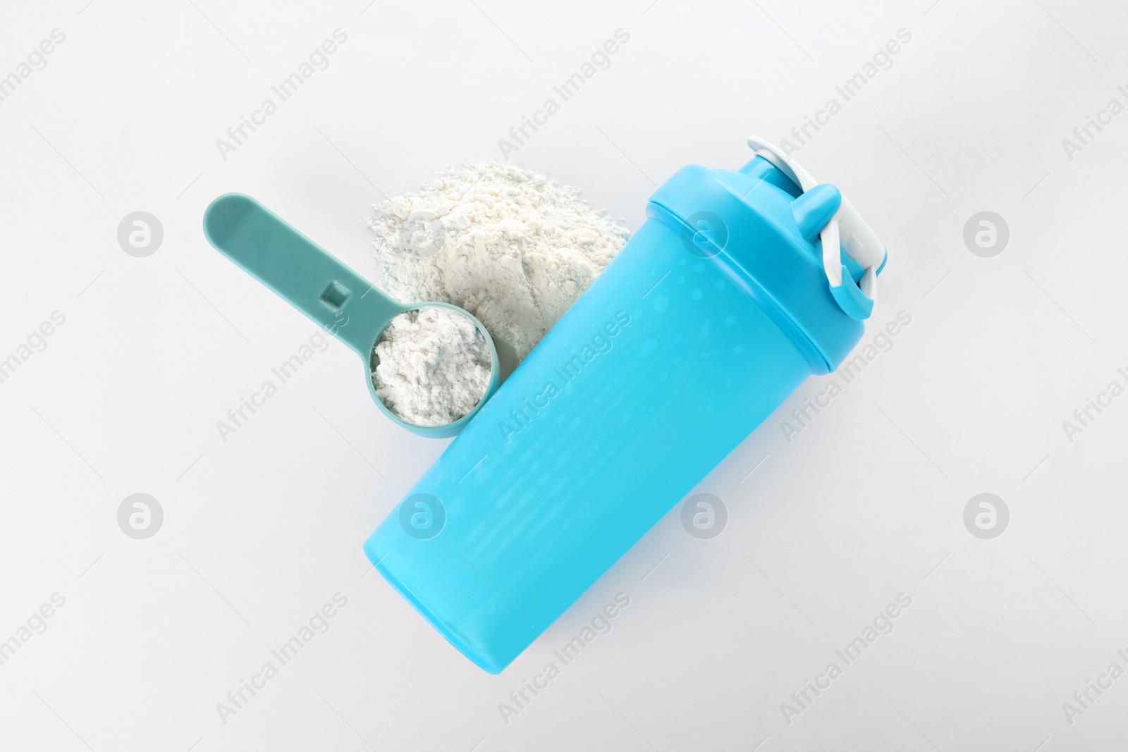 Photo of Scoop of protein powder and sports bottle isolated on white, top view