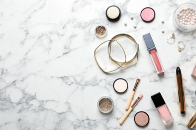 Beautiful composition with lipsticks and bijouterie on marble background, flat lay. Space for text