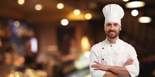 Image of Smiling chef in uniform at restaurant, space for text. Banner design
