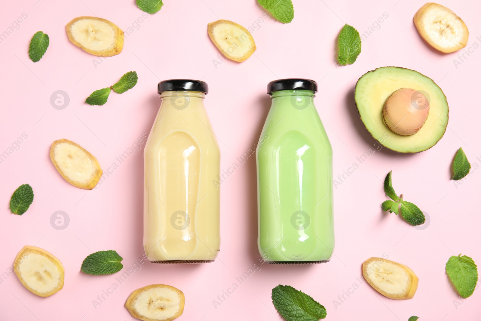 Photo of Flat lay composition with different smoothies in bottles and ingredients on color background