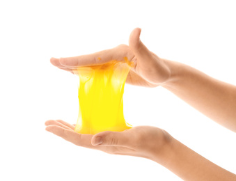 Woman playing with yellow slime isolated on white, closeup. Antistress toy