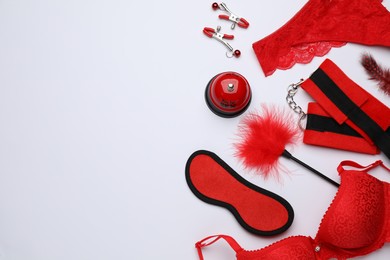 Photo of Sex toys and accessories on white background, flat lay. Space for text