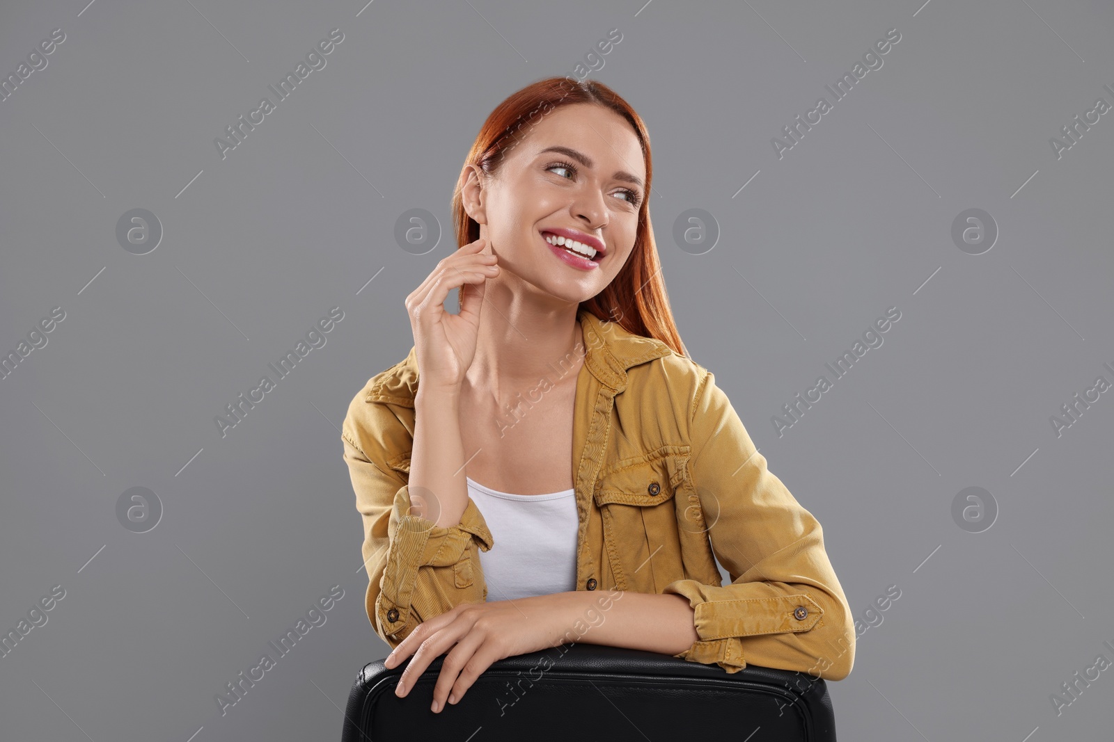 Photo of Casting call. Young woman performing on grey background