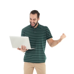 Emotional young man with laptop celebrating victory on white background