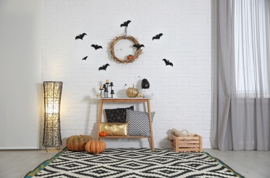 Photo of Stylish interior of room decorated for Halloween holiday