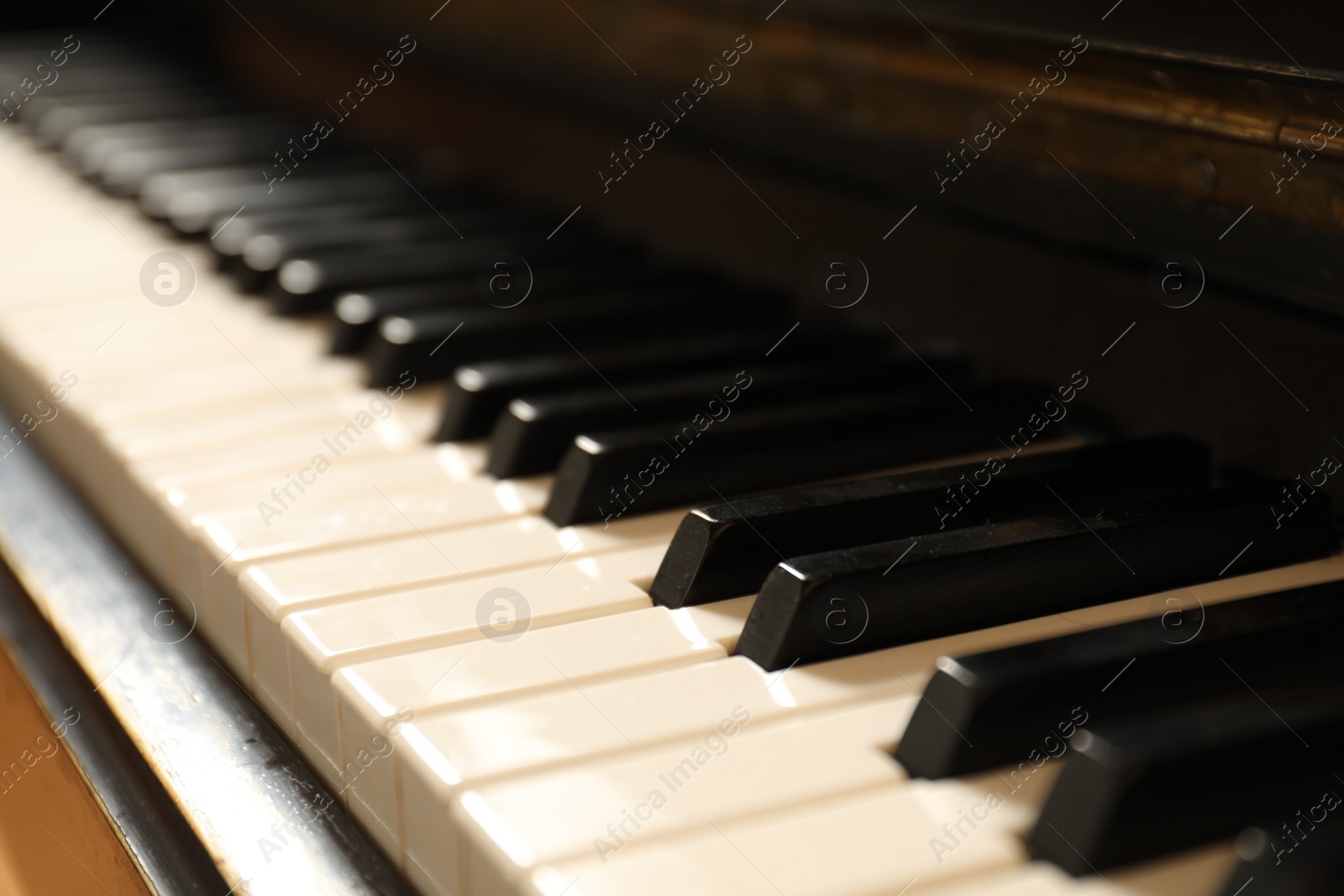 Photo of Modern piano with black and white keys, closeup