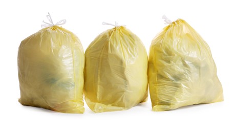 Trash bags full of garbage on white background