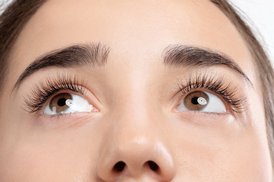 Photo of Young woman with beautiful eyelashes, closeup view