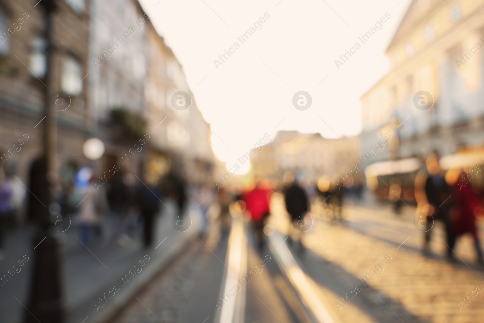 Photo of Blurred view of people walking on city street