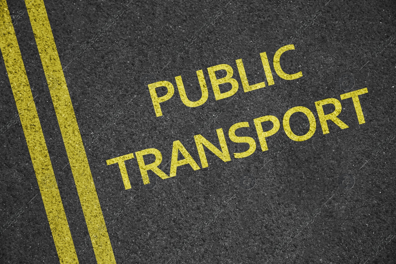 Image of Text PUBLIC TRANSPORT written on asphalt road, top view