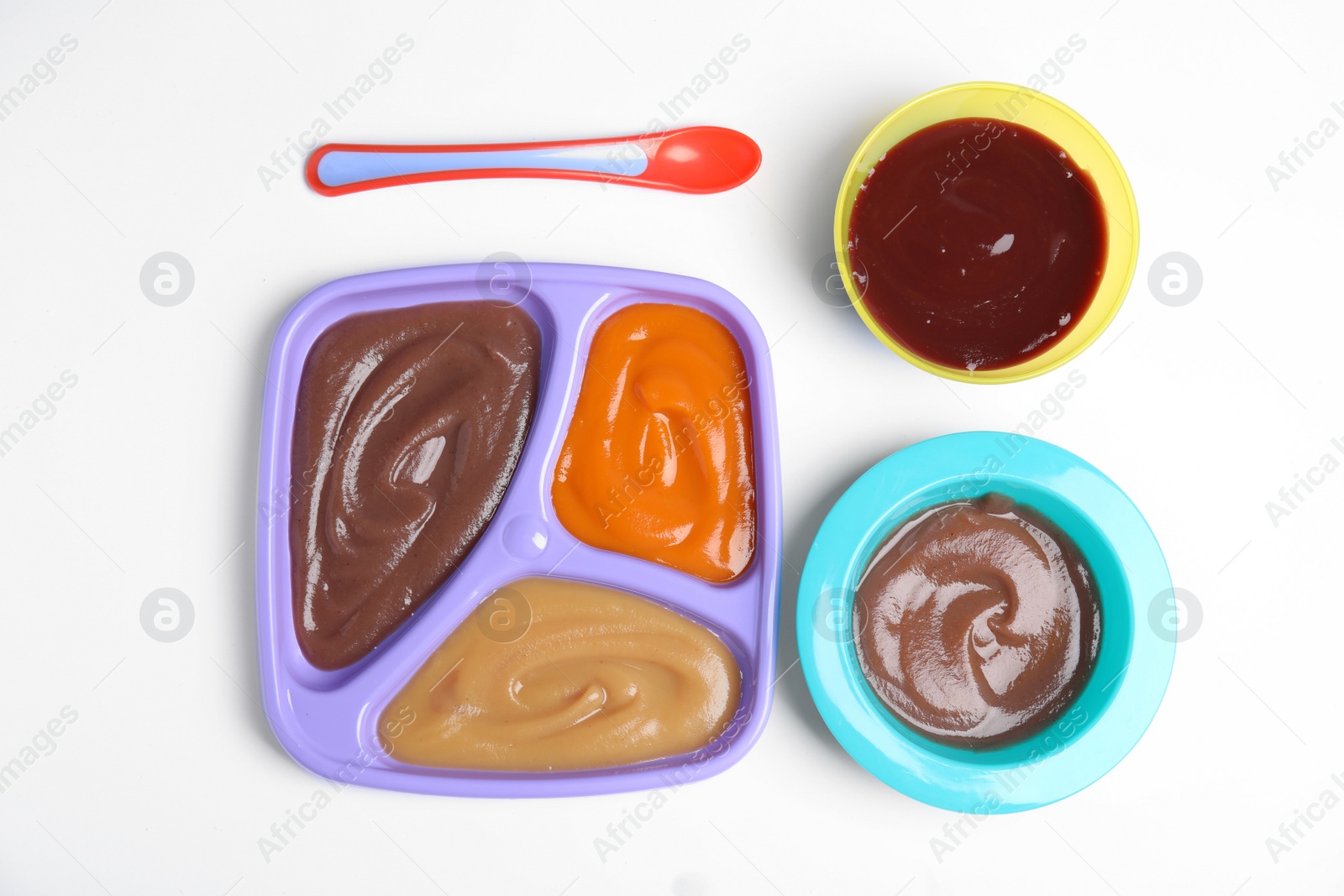 Photo of Flat lay composition with healthy baby food and spoon on white background