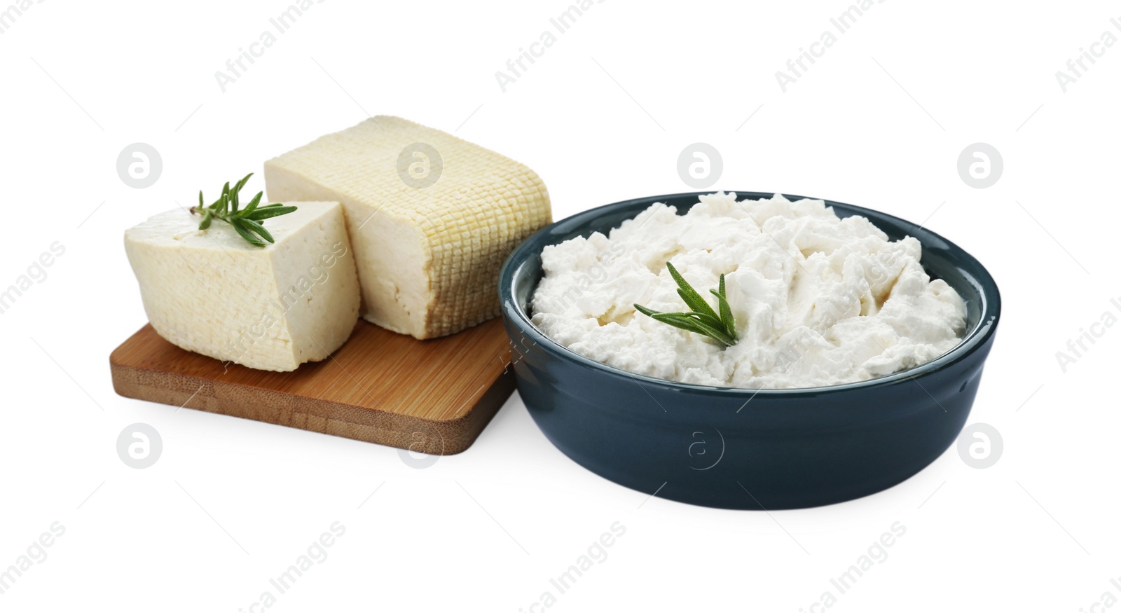 Photo of Different types of delicious tofu cheese with rosemary on white background