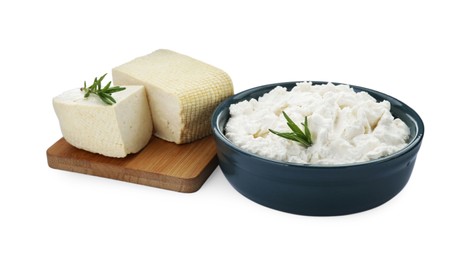 Photo of Different types of delicious tofu cheese with rosemary on white background