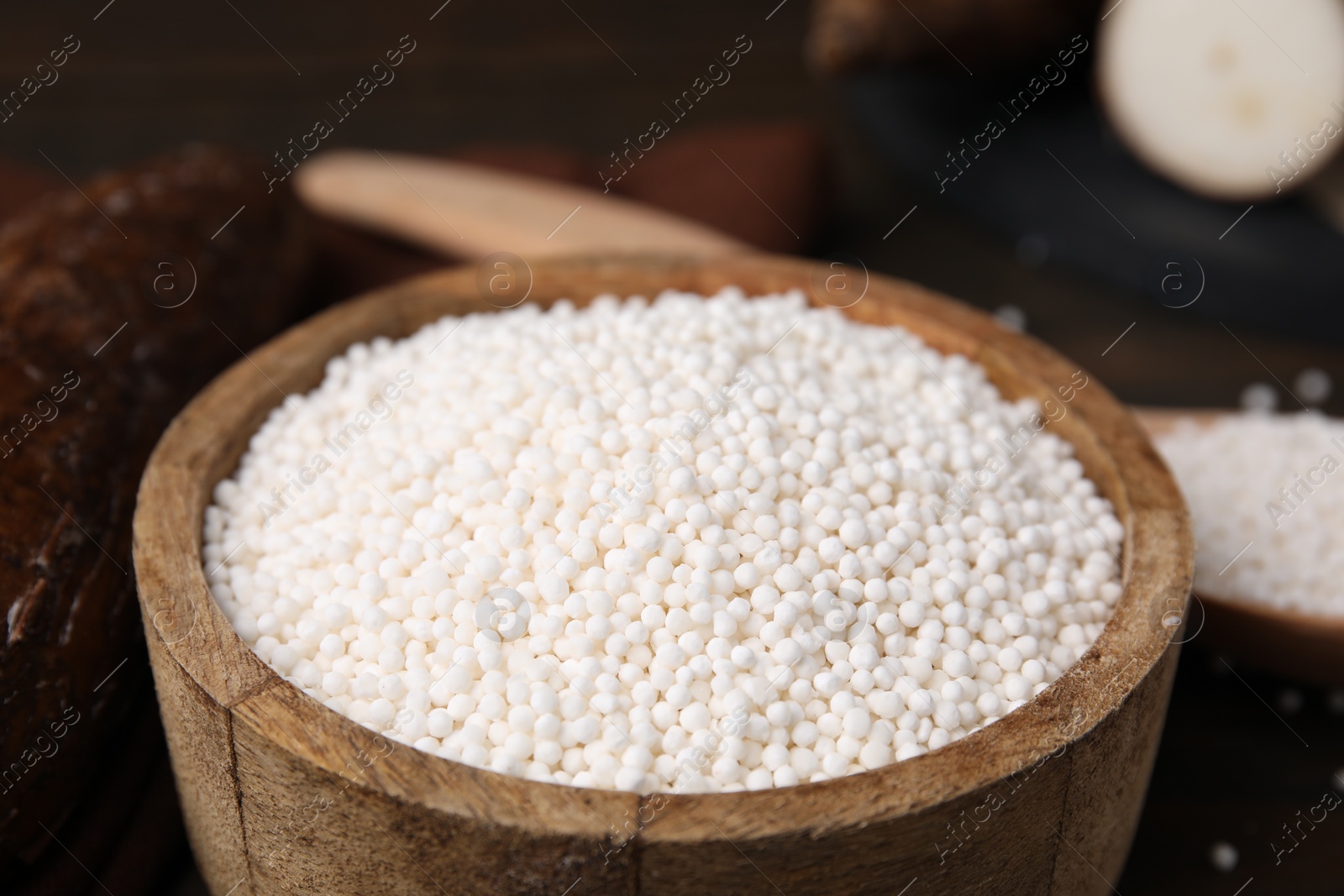 Photo of Tapioca pearls in bowl on table, closeup