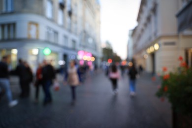 Blurred view of people walking on city street