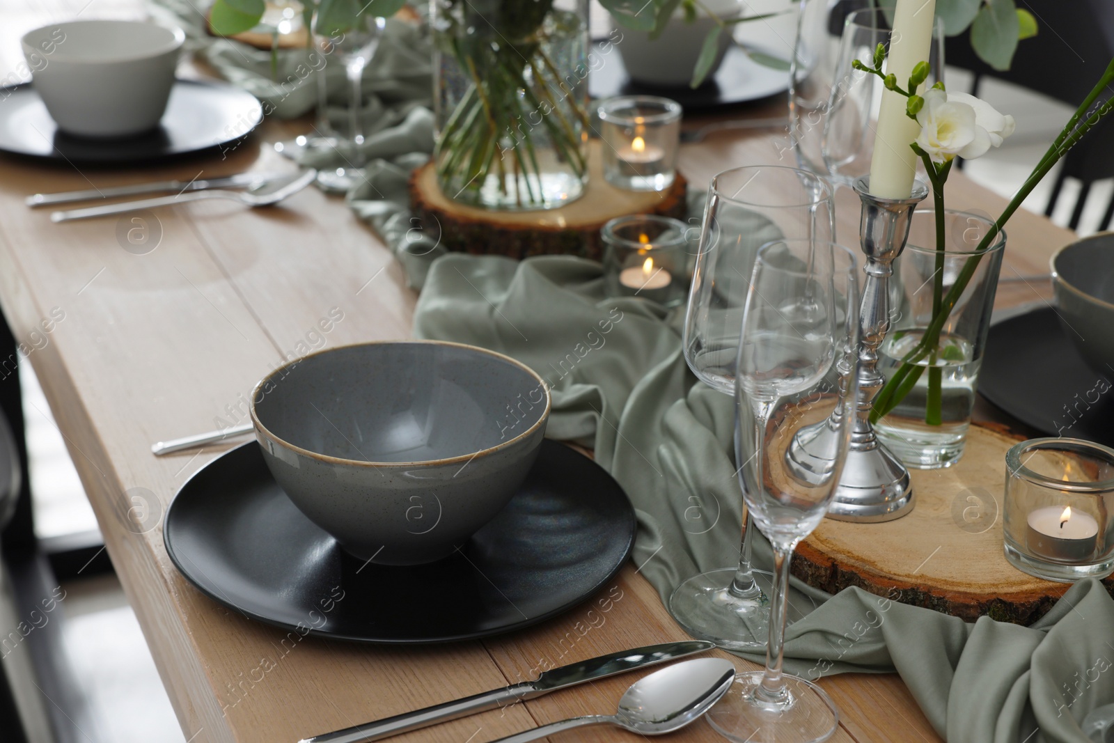 Photo of Festive table setting with beautiful tableware and decor