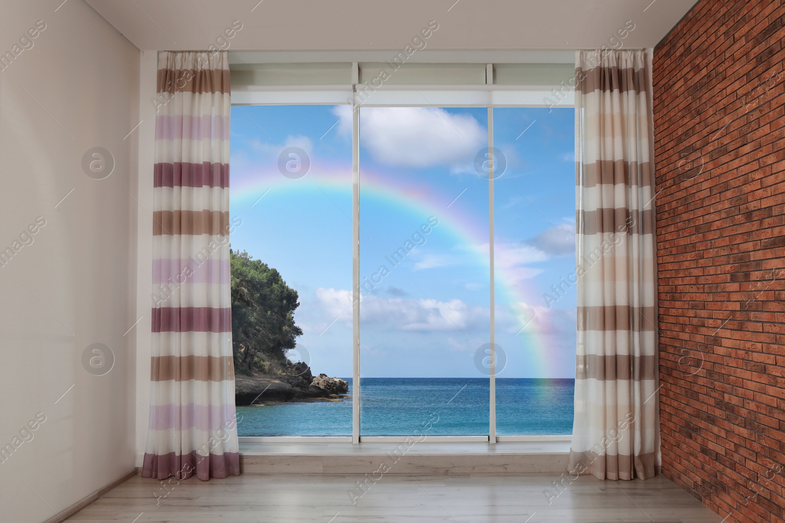 Image of View of beautiful rainbow over sea through big windows