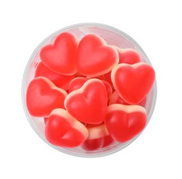 Glass with sweet heart shaped jelly candies on white background, top view