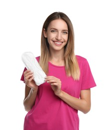 Happy young woman with disposable menstrual pad on white background