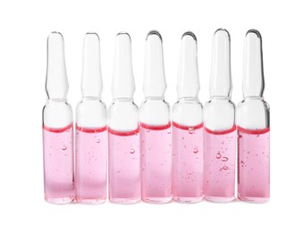 Photo of Pharmaceutical ampoules with medication on white background