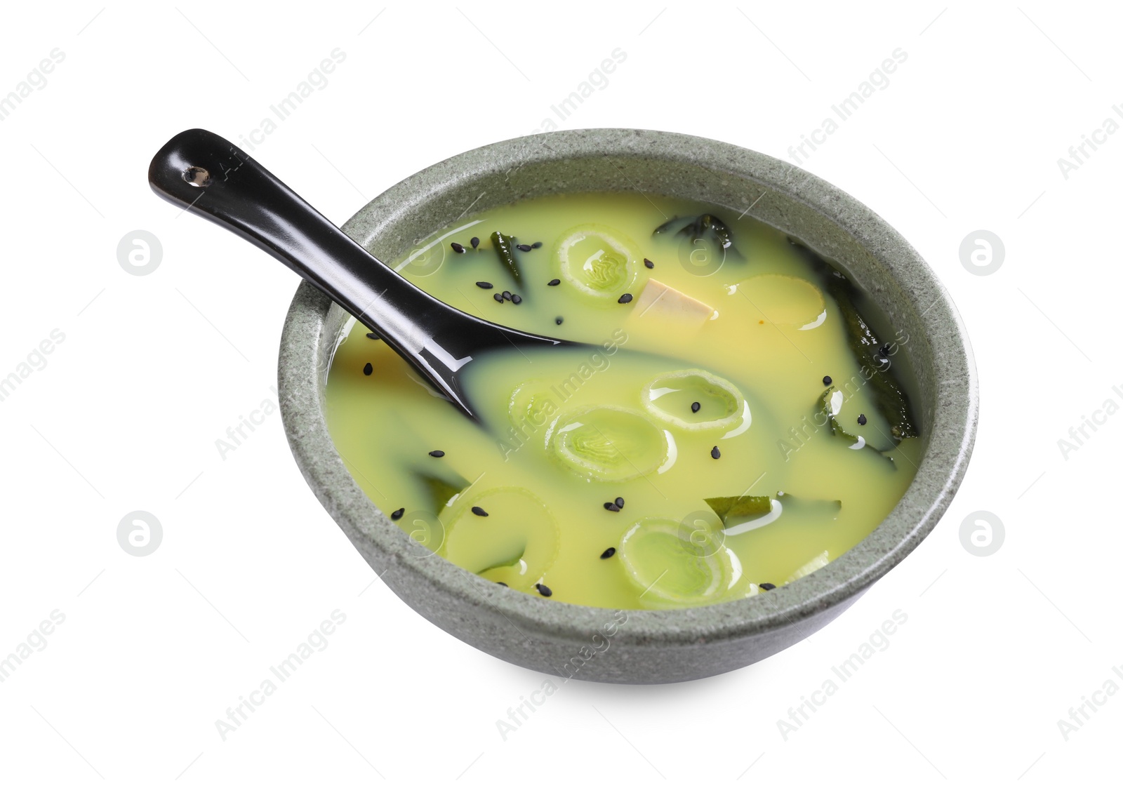 Photo of Bowl of delicious miso soup with tofu and spoon isolated on white