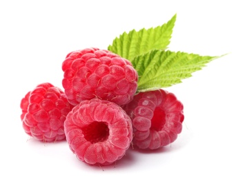 Photo of Delicious fresh ripe raspberries with leaves on white background