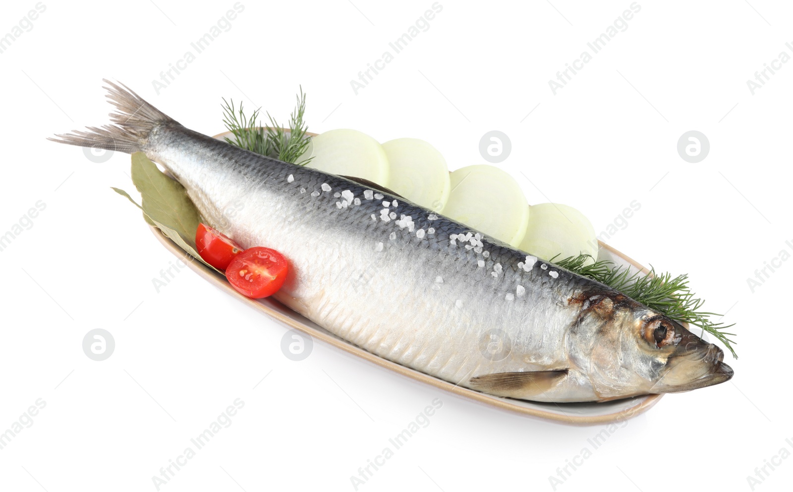 Photo of Plate with salted herring, onion rings, cherry tomato, bay leaves and dill isolated on white