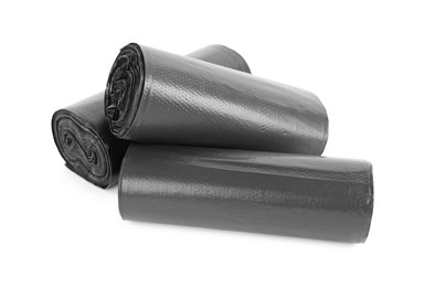 Photo of Rolls of black garbage bags isolated on white