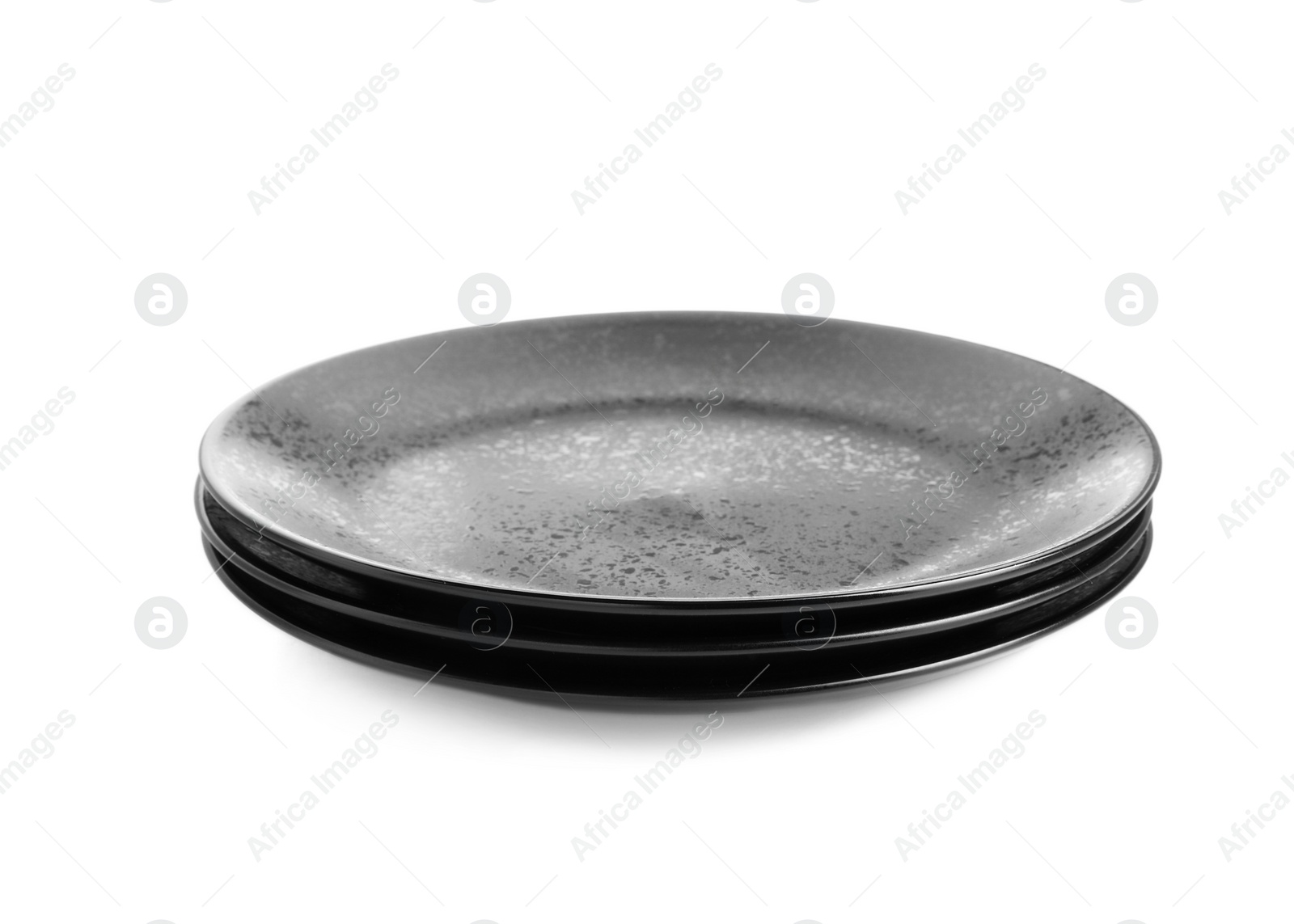 Photo of Three black ceramic plates isolated on white