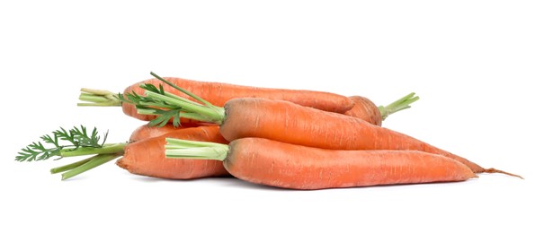 Photo of Pile of ripe juicy carrots on white background