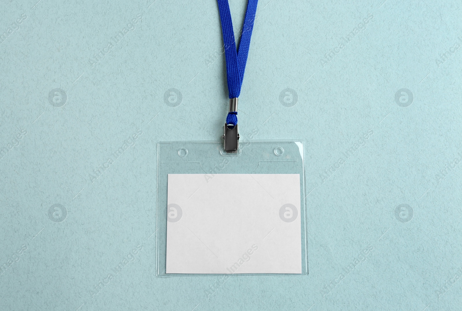 Photo of Blank badge on light table, top view. Mockup for design