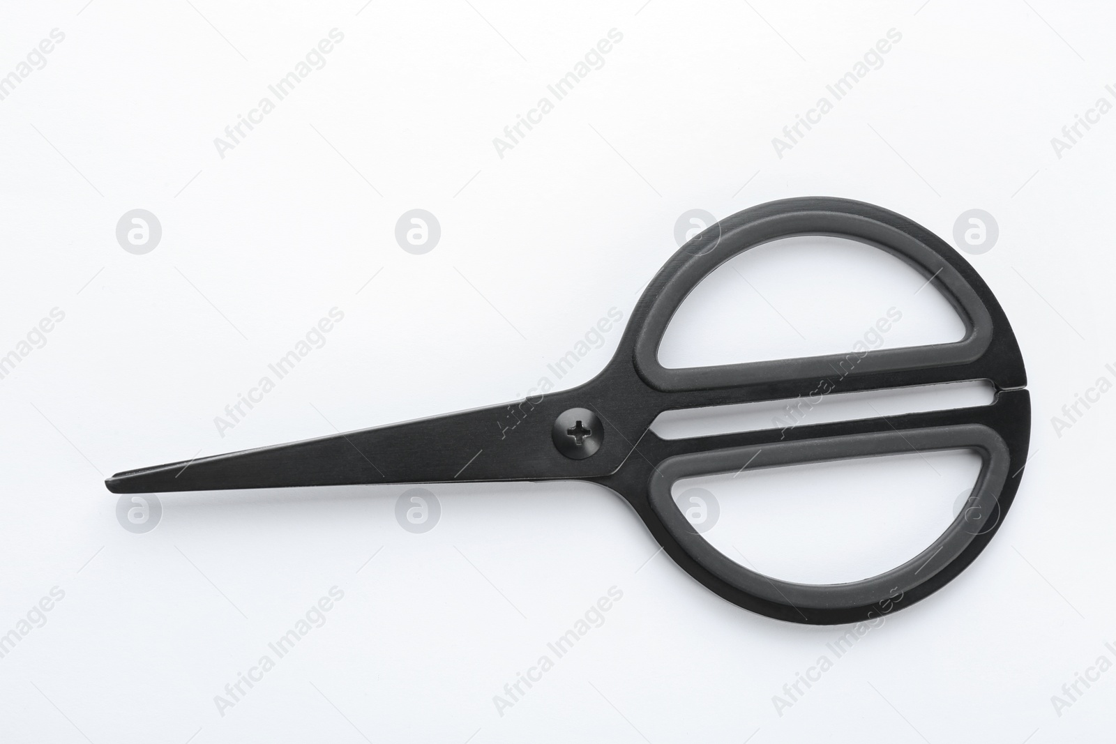 Photo of Pair of sharp scissors on white background