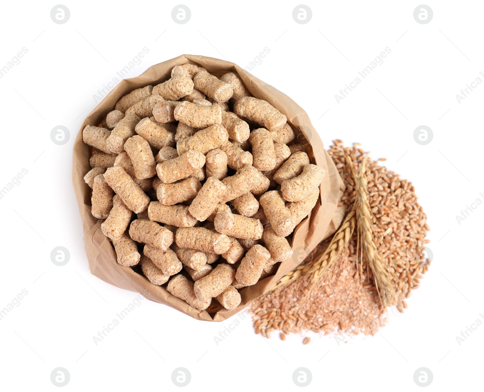 Photo of Granulated wheat bran in bag and spikelets on white background, top view