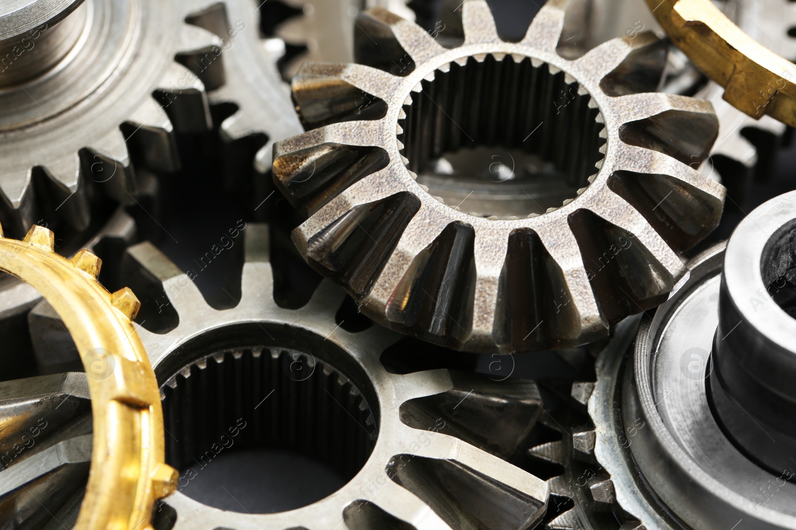 Photo of Many different stainless steel gears as background, closeup