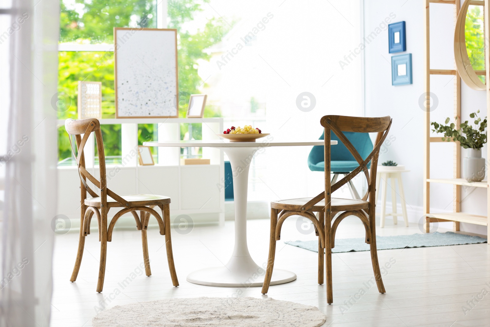 Photo of Modern dining room interior with table and chairs