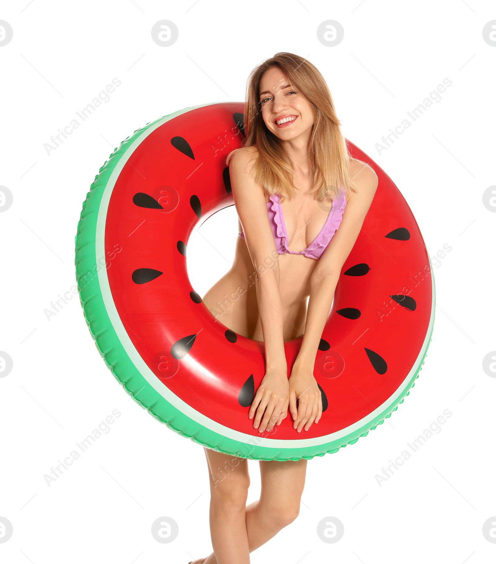 Photo of Beautiful young woman in stylish bikini with watermelon inflatable ring on white background