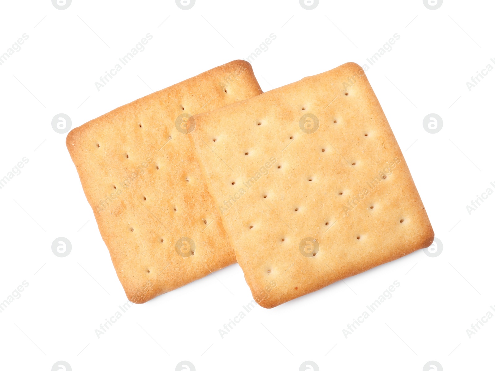 Photo of Two crispy crackers isolated on white, top view. Delicious snack