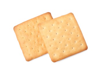 Two crispy crackers isolated on white, top view. Delicious snack