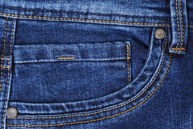 Blue jeans with inset pocket as background, closeup