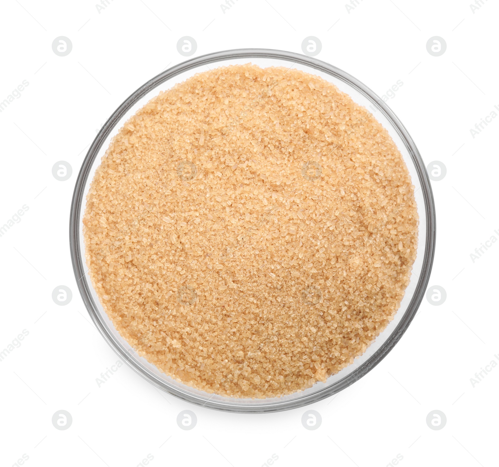 Photo of Glass bowl with brown sugar isolated on white, top view