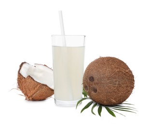 Photo of Glass of coconut water, leaf and nuts isolated on white