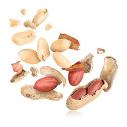 Image of Peanuts and crushed pods in air on white background