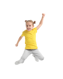 Cute little girl jumping on white background