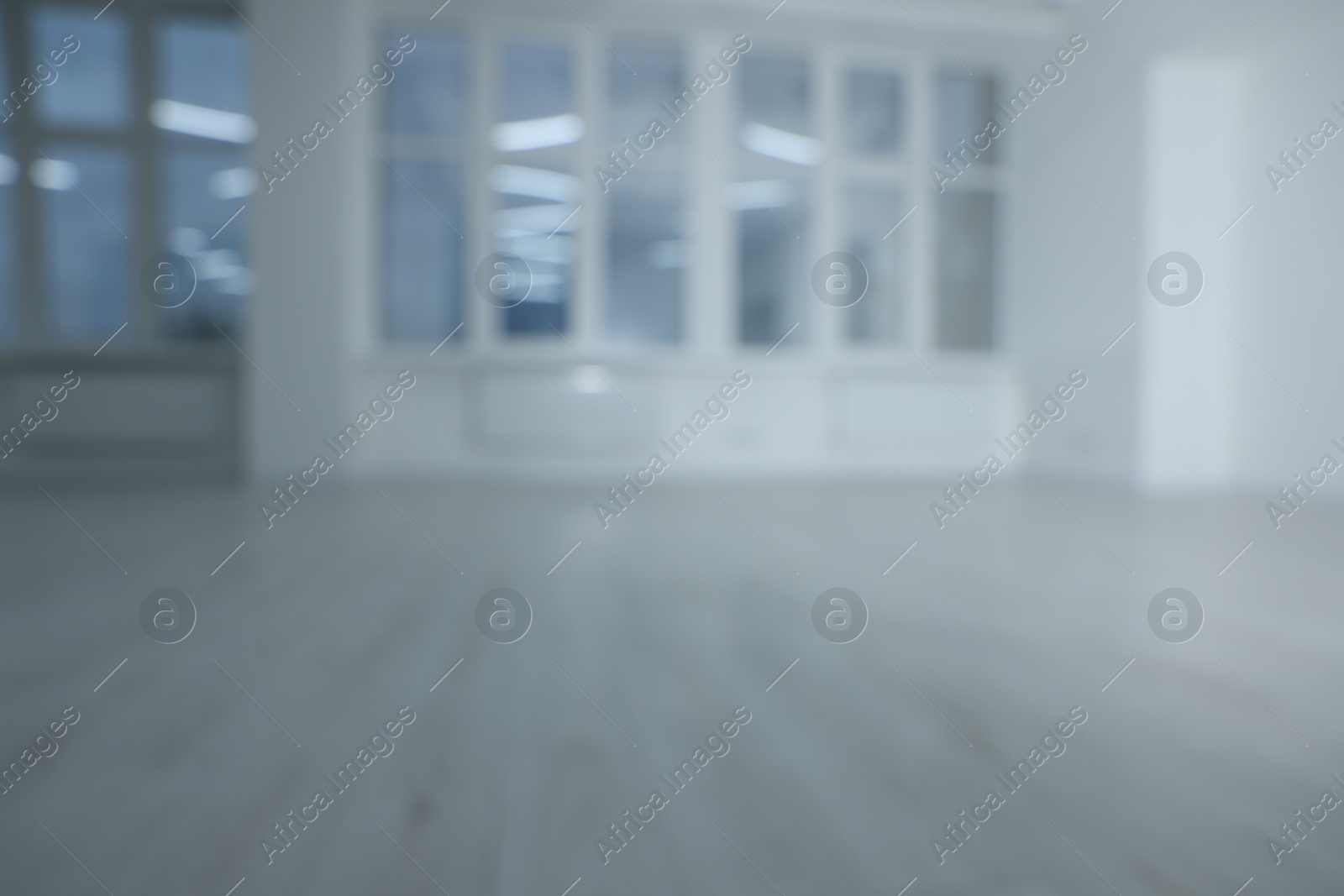 Photo of Blurred view of new empty room with windows