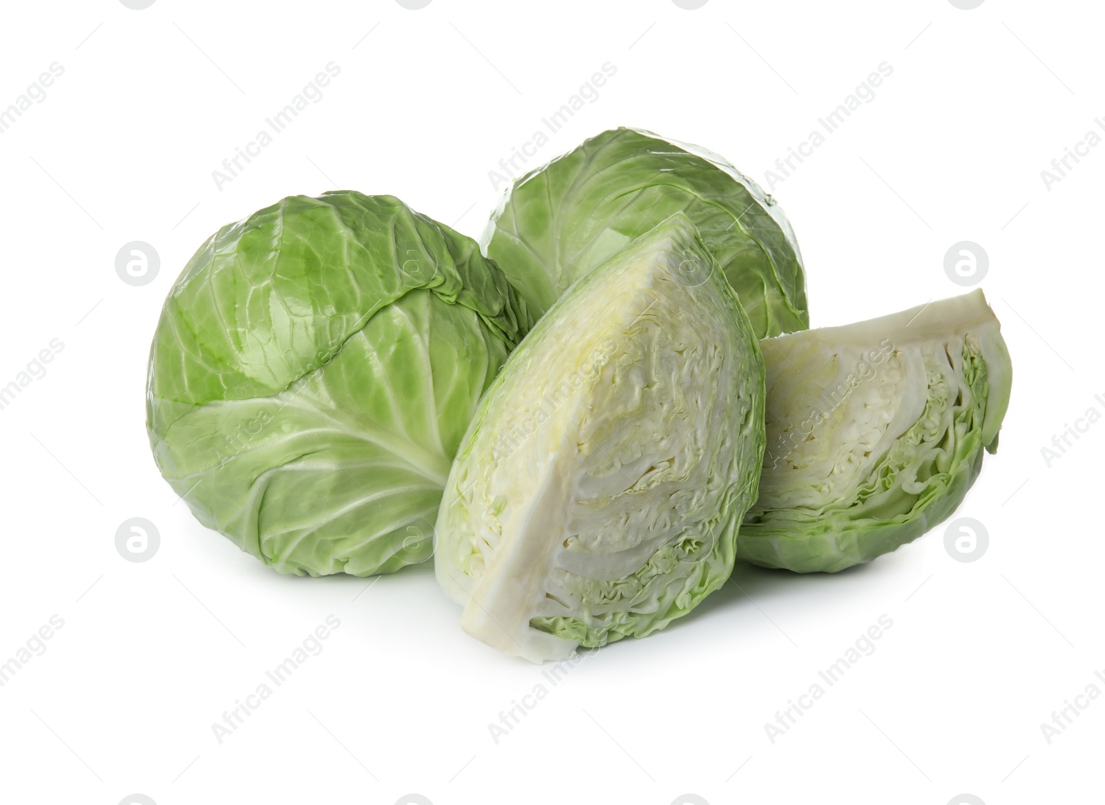 Photo of Whole and sliced cabbages on white background. Healthy food