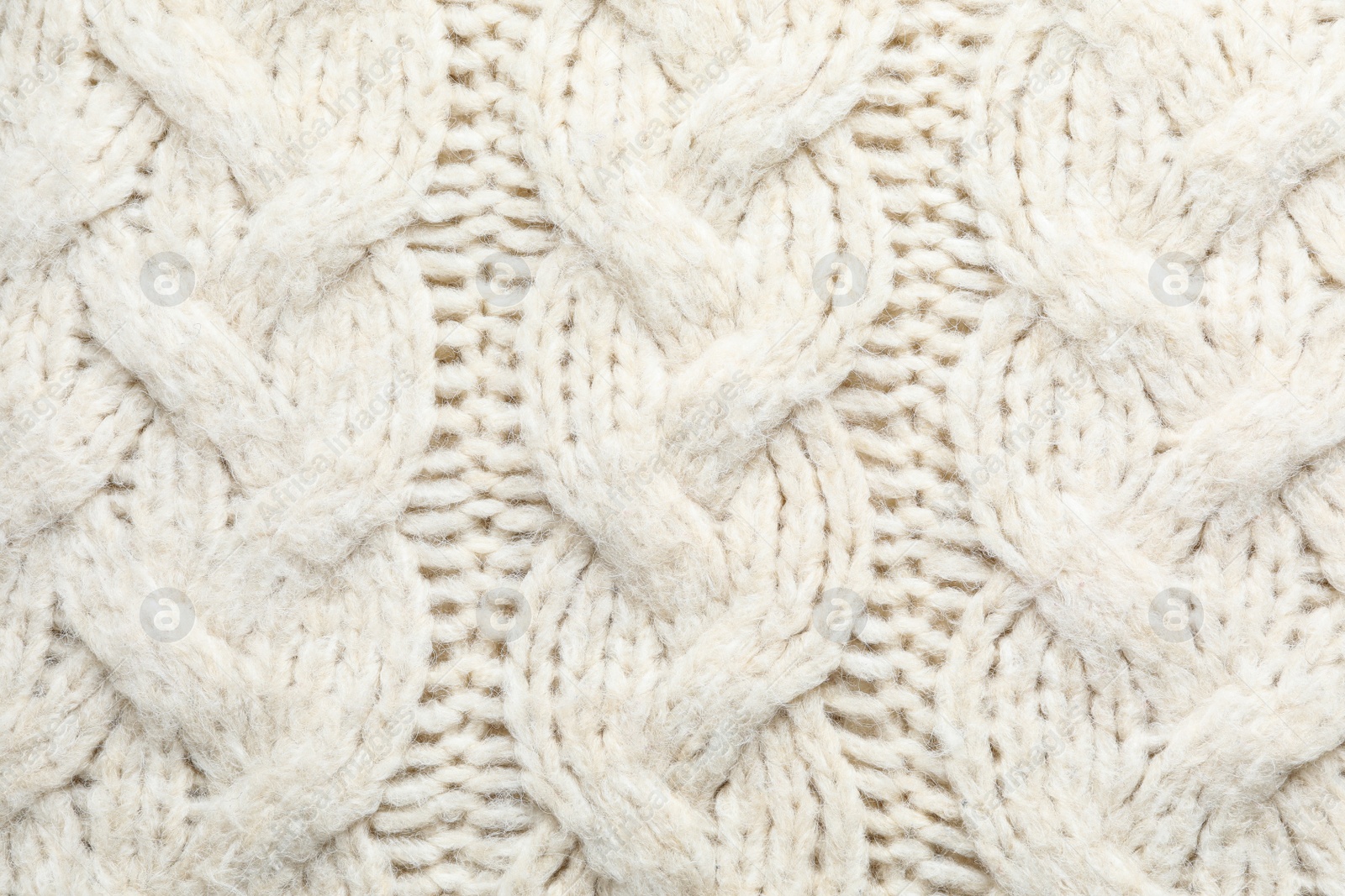 Photo of White winter sweater as background, closeup view