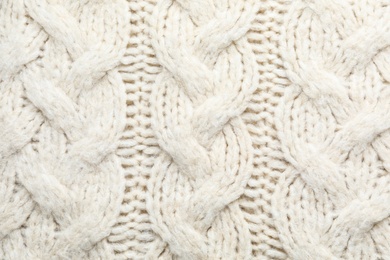 White winter sweater as background, closeup view