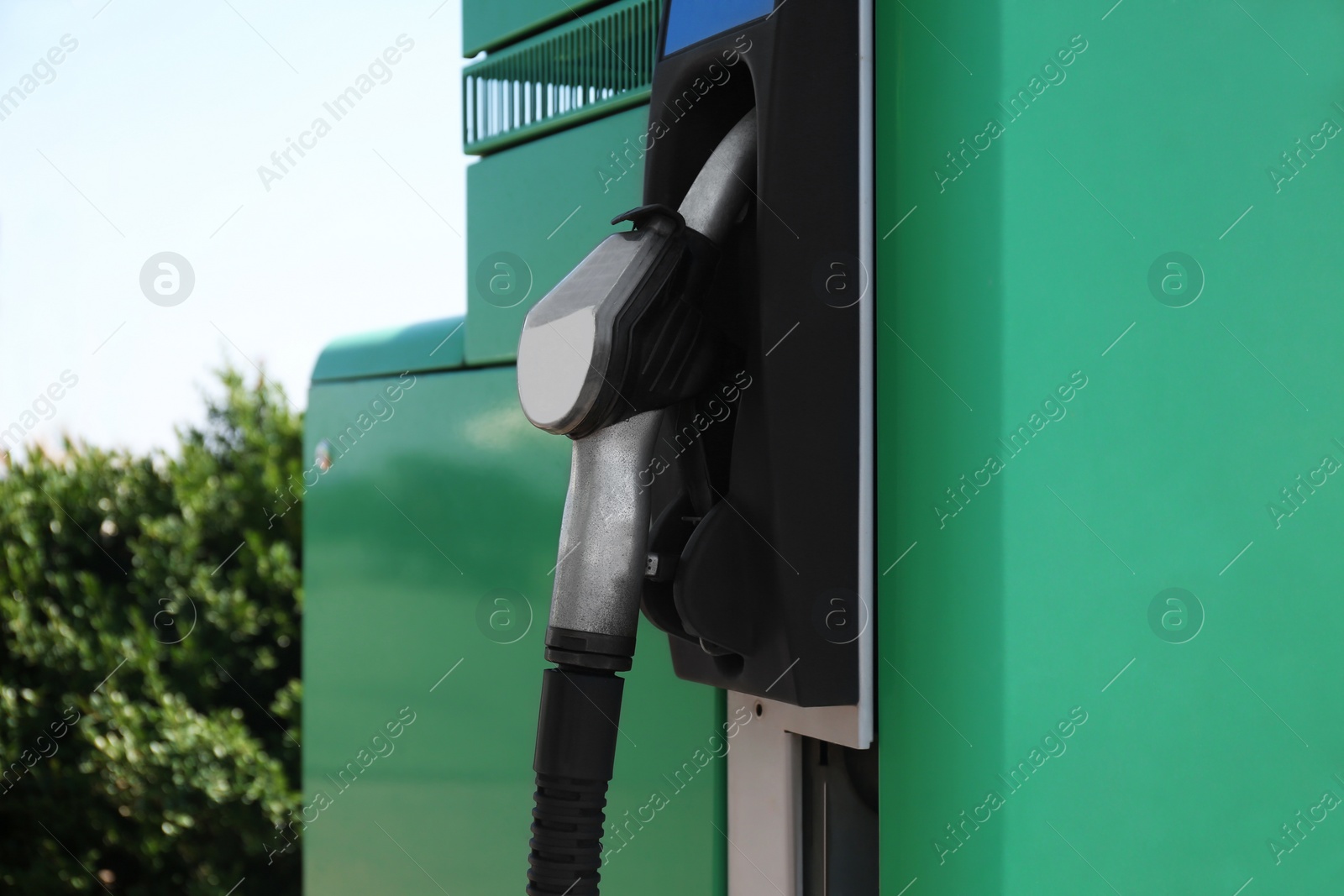 Photo of Closeup view of pump nozzle at gas station