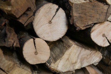 Stacked firewood as background. Heating house in winter